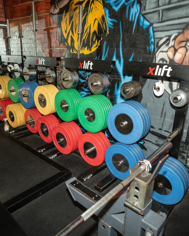 Weight plates racked at Norton Gym